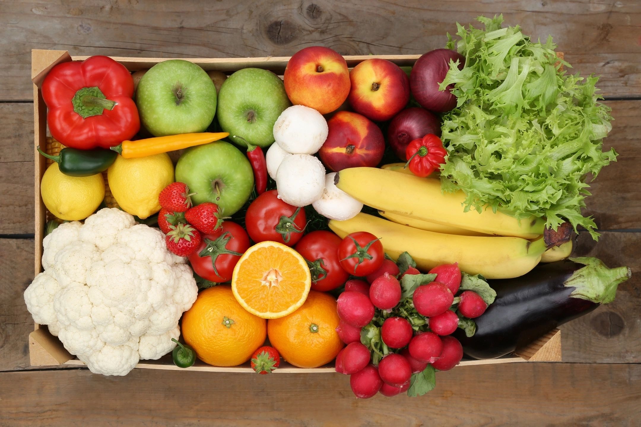 Crate filled with fresh colorful produce